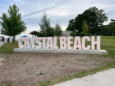 a sign for a coastal beach in a park at Crystal Beach home in Niagara in Fort Erie