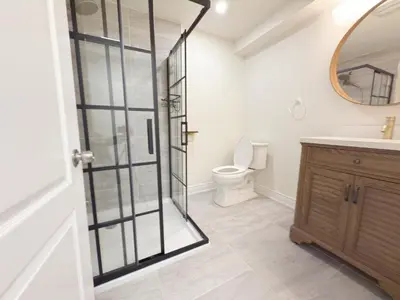 a bathroom with a shower and a toilet at Cozy room with private bath near Don Mills Subway in Toronto