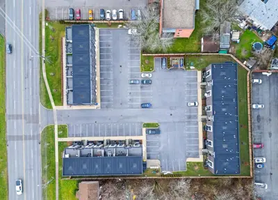 an overhead view of a building with parking at NEW Stylish 2BR Suite With Sofa Bed, 7 Mins to Niagara Falls and Sleeps 6 in Niagara Falls