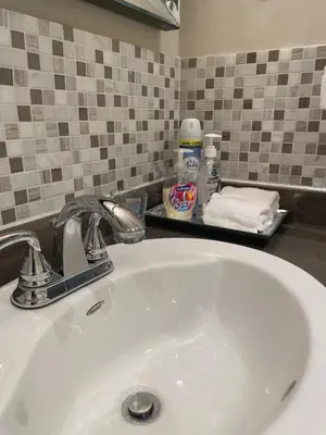 a bathroom sink with a faucet on a counter at Welcoming homestay with relaxing private room in Oakville