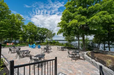 a group of tables and chairs on a brick patio at The Clover - 91 Butternut in Cherry Valley