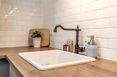 a kitchen counter with a sink and a faucet at Rustic Loft at Blue in Blue Mountains
