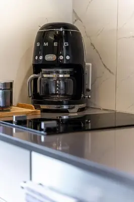 a coffee maker sitting on top of a counter at MR Loft formerly The Lehman Studio Stratford in Stratford