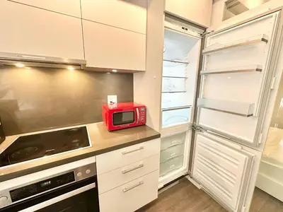 a kitchen with a microwave and a refrigerator at Condo in Yorkville - Newly Furnished Luxury Unit in Toronto