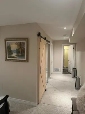 a hallway with a door leading into a room at Toronto downtown Woodbine beaches private cozy room in Toronto