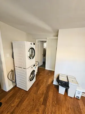 a room with a washer and dryer in a room at Spacious 2-bedroom ground floor unit near beach in Cobourg