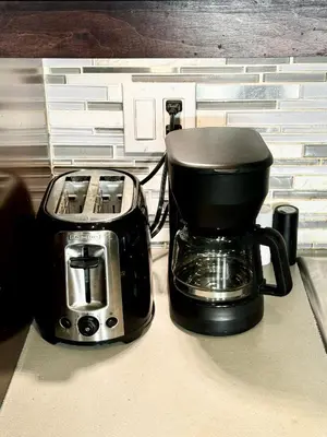 a coffee maker and toaster sitting on a counter at 3500 SqFt - Modern and Comfort - 4 BDRM Getaway - Relax - Unwind - Explore - Near Airport & Toronto Downtown in Brampton