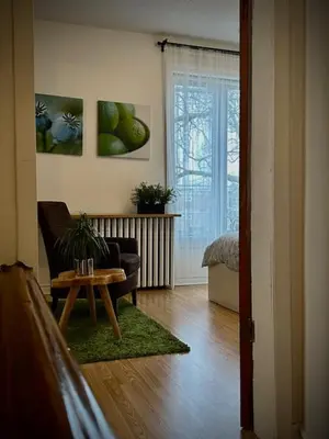 a living room with a couch and a table at Girls Night Out in Toronto