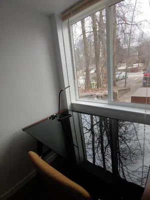 a room with a window with a chair and a desk at Two bedroom on Toronto Greenhills in Toronto
