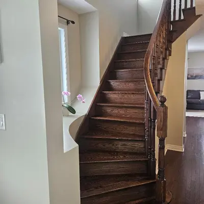 a staircase in a home with wood floors at Exquisite Junior Bedroom in Brampton