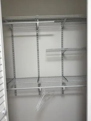 a walk in closet with metal shelves at Modern & Stylish 2BR Apartment 658 in Peterborough