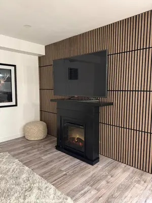 a living room with a fireplace with a flat screen tv over it at Modern & Stylish 2BR Apartment 658 in Peterborough