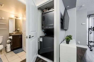 a bathroom with a television on top of a stove at Urban Oasis - Modern 1 bedroom w pool access free parking in Toronto