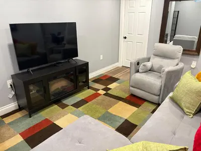 a living room with a fireplace and a television at Bolster in Uxbridge