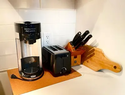 a kitchen counter with a coffee maker on a counter at Excellent Private Suite in Bloor West Village in Toronto