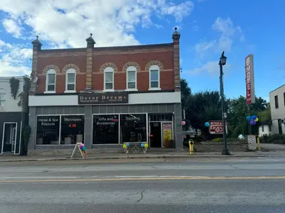 a brick building on the corner of a street at Decor Dreams in Stayner