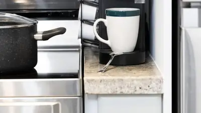 a coffee pot sitting on a counter in a kitchen at Modern 1BR Condo in Church Yonge Corridor in Toronto