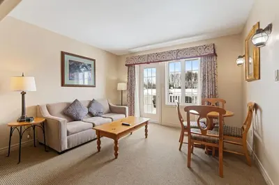 a living room with a couch and a table at Peaceful Escape King Bed and Outdoor Activities in Edgar