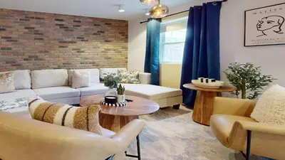 a living room with a couch and chairs and a table at Casa Hotel Elegant 2BR Suite in Leslieville in Toronto