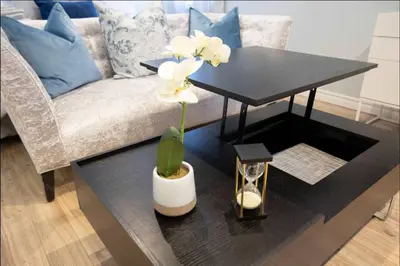 a living room with a black table and a couch at Casa Hotel Stylish Suite with Patio in Leslieville in Toronto