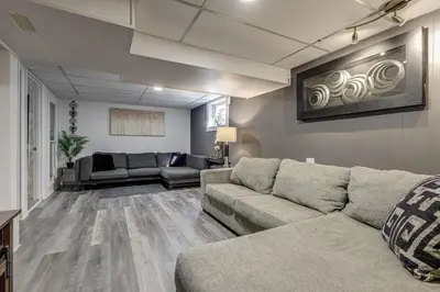 a living room with two couches and a couch at Spacious Pool House 5 Minutes to Elgin Centre in Saint Thomas