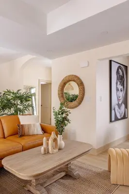 a living room with a couch and a coffee table at The California Sunset in St. Catharines