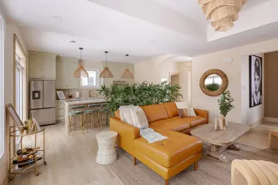 a living room with a couch and a table at The California Sunset in St. Catharines