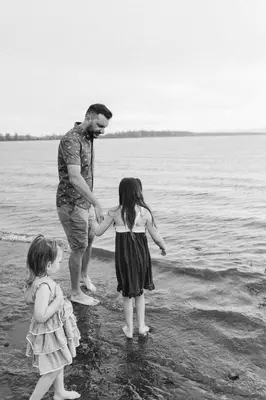 a man and two little girls standing in the water at The Copper - 11 Butternut in Cherry Valley