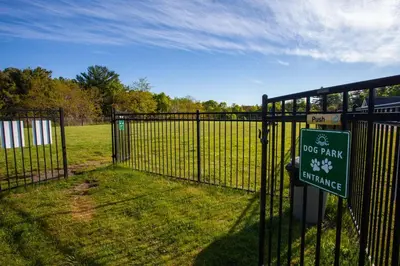 a fence with a dog park entrance sign on it at The Balsam - 36 Farm View in Cherry Valley