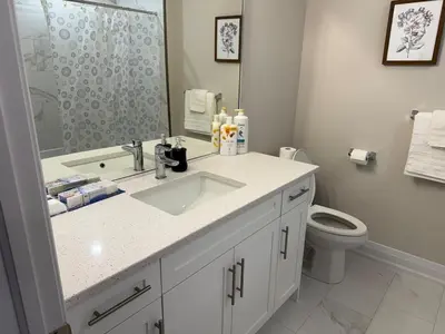 a bathroom with a sink and a toilet at Cozy 3 Bedroom Townhome Hyde Park Mall & Western University in London