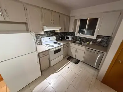 a kitchen with white appliances and a white refrigerator at Affordable Family Room for 4 People-24Hrs Checkin-Next To Downtown,Airport in Kitchener