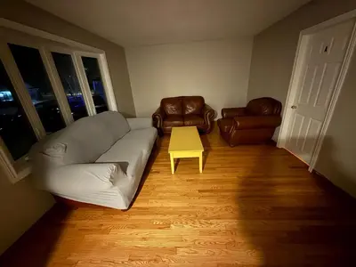 a living room with a couch and a table at STAY AT FLAT CAD 39- Next to Airport, Transit, Park in Kitchener