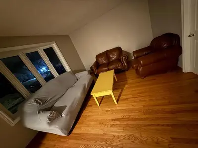 a living room with a couch and a table at STAY AT FLAT CAD 39- Next to Airport, Transit, Park in Kitchener