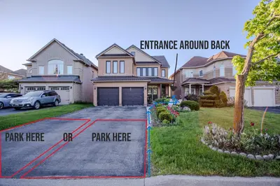 a driveway of a house with a driveway around it at Richmond Hill Ravine Retreat in Richmond Hill