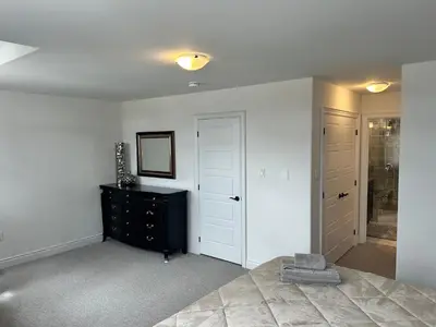 a bedroom with a bed and a dresser and a closet at The Angus Nest in Angus