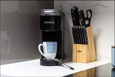 a coffee maker and a cup on a shelf at Casa Hotel Elegant Suite w Patio BBQ Grill in Toronto