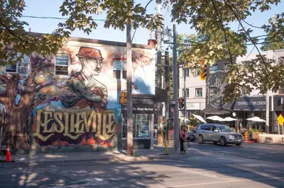 a mural on the side of a building on a street at Casa Leslieville - 2BR Suite with LRG Patio in Toronto