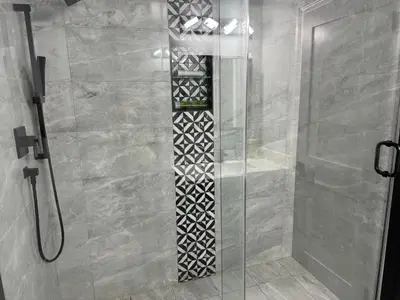 a shower with a glass door and a walk in shower at Oshawa Connect - Prime Location, Modern Space in Oshawa