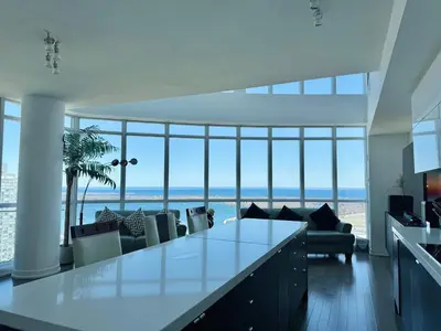 a living room with a view of the ocean at Two Storey Penthouse with 2 Parkings and Lake & City Views in Toronto