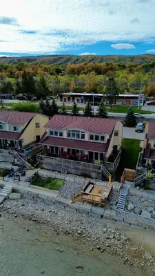 an aerial view of a house next to the water at Blue View Chalets in Blue Mountains