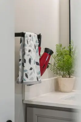 a towel hanging on a kitchen counter next to a plant at Baker Hill Executive Suite 2 Br Basement Apartment with Full Kitchen and Bath in Stouffville