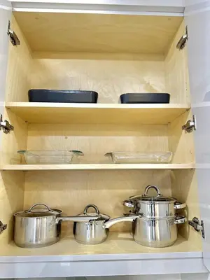 two pots and pans on a shelf in a kitchen at Bright Luxurious 2 Bedroom Apartment in Toronto