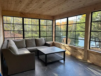 a living room with a couch and a coffee table at Wiley Woods Cottage in Minden