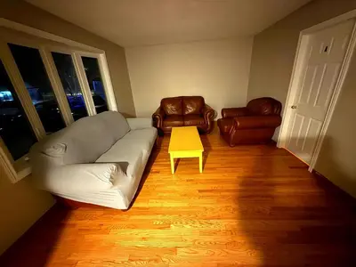 a living room with a couch and two chairs at YKF Airport Home-FREE FAST WIFI-FREE PARKING in Hespeler