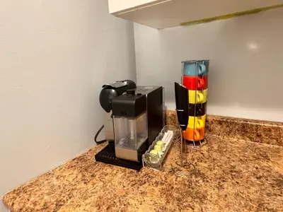a coffee maker sitting on top of a counter at Steps to Bars & Fun in Port Credit in Mississauga