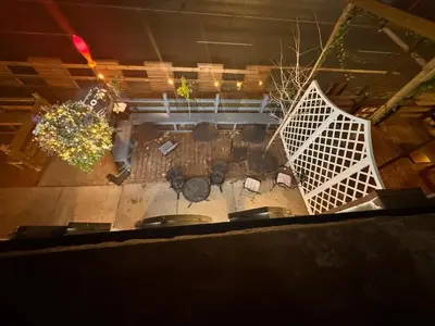 an overhead view of a patio with tables and chairs at Steps to Bars & Fun in Port Credit in Mississauga