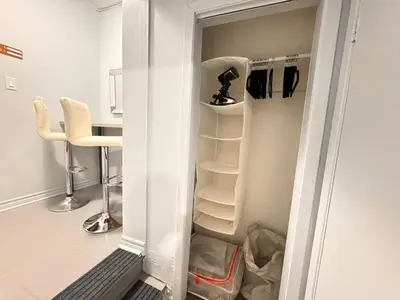 a small white refrigerator with its door open at Steps to Bars & Fun in Port Credit in Mississauga