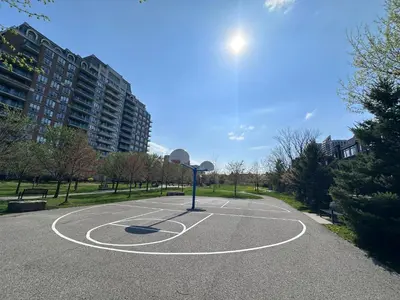 a basketball court with a basketball hoop in a park at 2bedroom Townhome in South Richmond Hill in Richmond Hill