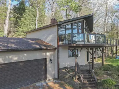 a house with a glass roof and a garage at Villa Marina Haven private Waterfront in Port Carling