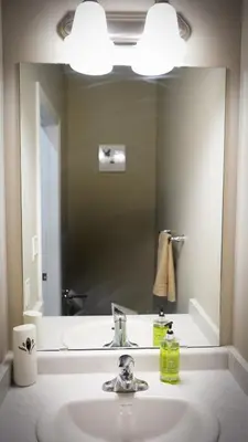 a bathroom with a sink and a large mirror at Stunning fully furnished detached house 4 Bed Retreat, with complete privacy and comfort, WiFi & Full Kitchen in Paris
